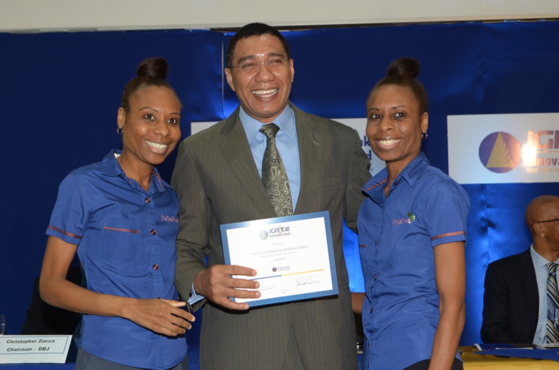 DeJaFrut receiving the IGNITE Innovation Grant from Prime Minister Andrew Holness